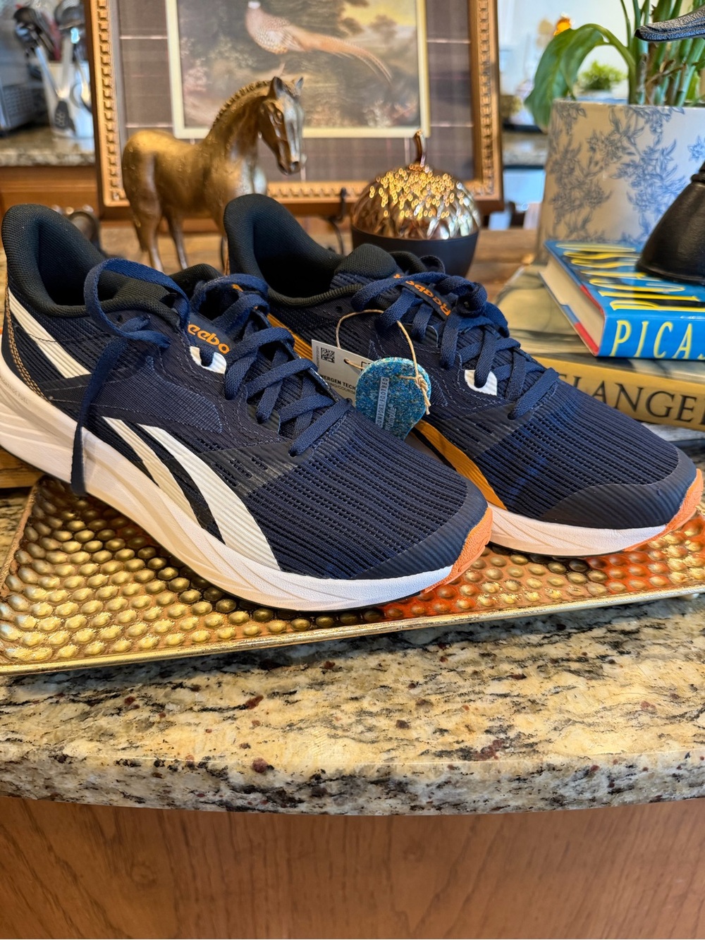 Reebok Women’s Navy Athletic Shoes with White Stripes and Orange Accents